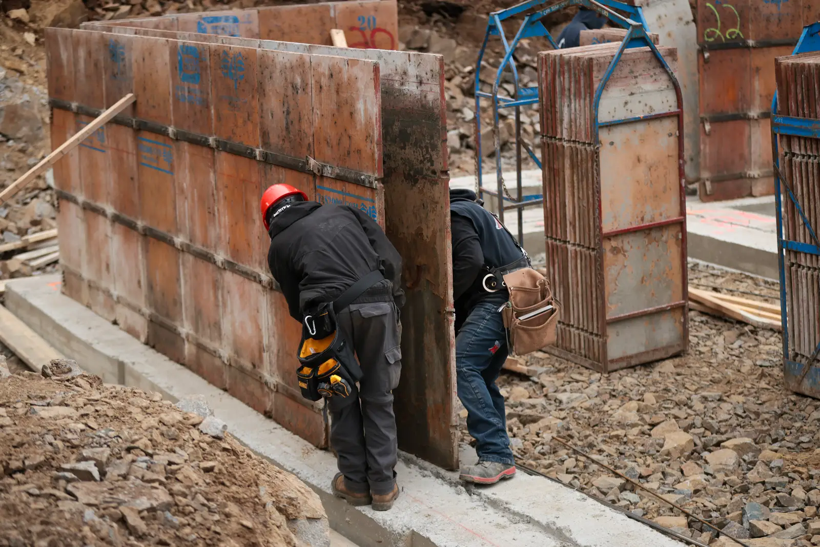 Forming wall being erected on a concrete footing.
