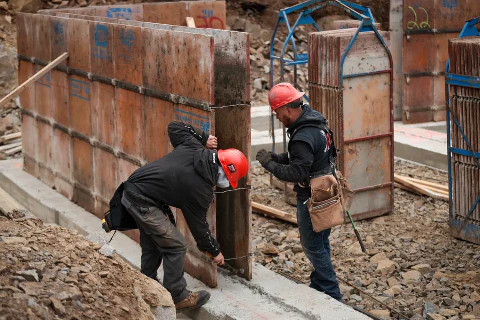 Forming wall fully erected on a concrete footing.